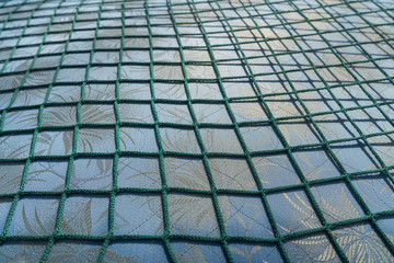 green net over a fabric pattern for backgrounds