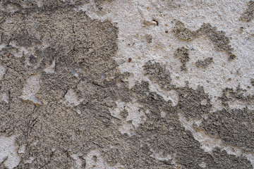 old grungy wall with peeling plaster, for backgrounds