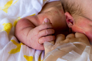 Newborn Holding Mothers Finger