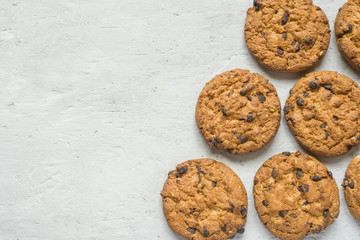 Homemade cookies with chocolate on a grey table. Chocolate chip cookie shot