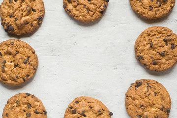 Homemade cookies with chocolate on a grey table. Chocolate chip cookie shot