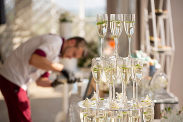pyramid from glasses of champagne on wedding party