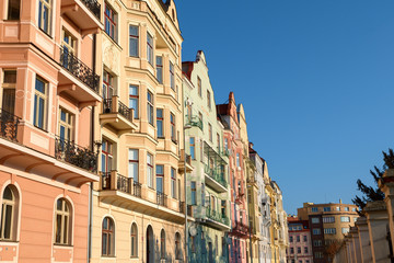 Fototapeta na wymiar Row of colorful houses in Prague in morning light on sunny day, Czech republic