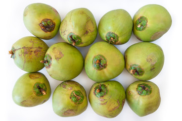 Fresh coconuts ,top view..Green coconuts laying isolated on white background.