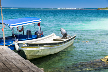 Fototapeta na wymiar Small boats for tourist in the Caribbean sea near the resorts and small islands