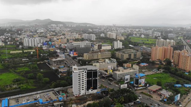 Aerial panoramic view of cityscape of modern industrial city of Pune during monsoon season - Maharashtra, landscape panorama of India, Asia from above