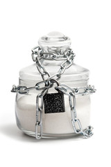 glass sugar bowl locked with chain and padlock, isolated on white background