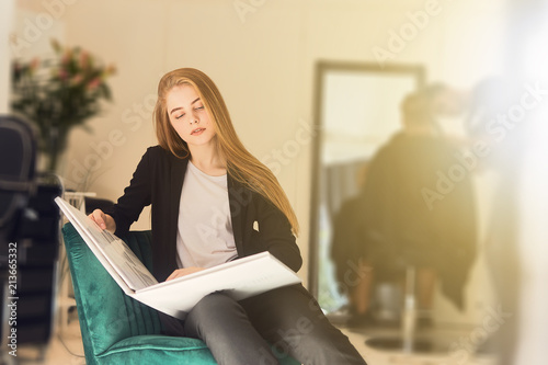 Pretty Girl Read Book In Hairdresser Shop Stock Photo And Royalty