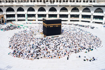 MECCA, SAUDI ARABIA - MAY 05 2018: Prayer time Asr in Mecca. People making salat or salah around Holy Kaaba. Photo taken during the praying at position Sujood from the top of Al Masjid Al Haram Mosque