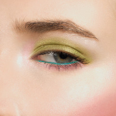 Obraz premium Beautiful blue eyes with bright creative cosmetics. Long eyebrows and dense eyelashes create the fashionable image. Evening cosmetics, cosmetics, cosmetology