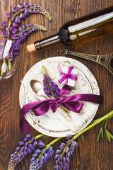 Tableware with violet lupines and silverware