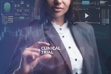 The concept of business, technology, the Internet and the network. A young entrepreneur working on a virtual screen of the future and sees the inscription: Clinical trial