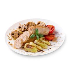 Roasted sausages with tomato sauce and vegetables on a white background