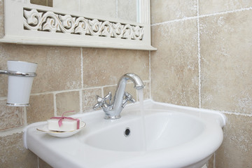 Bathroom with sink basin faucet