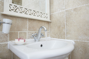 Bathroom with sink basin faucet