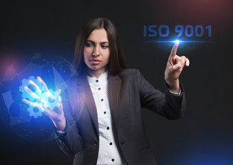 The concept of business, technology, the Internet and the network. A young entrepreneur working on a virtual screen of the future and sees the inscription: ISO 9001