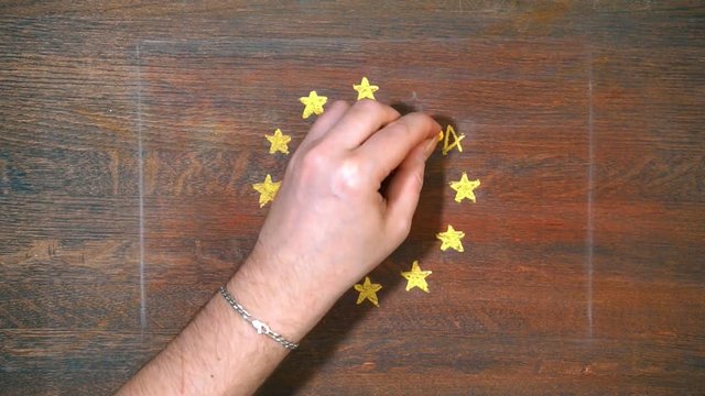 Yellow arrow against the background of the EU flag. finance