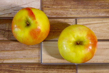 juicy and ripe apples on a wooden background
