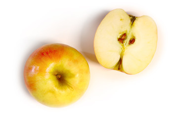 juicy and ripe apples and slices on a light background