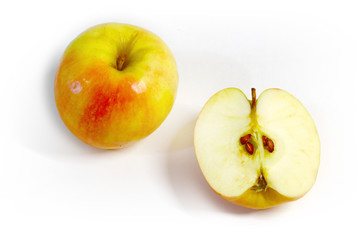 juicy and ripe apples and slices on a light background