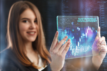 The concept of business, technology, the Internet and the network. A young entrepreneur working on a virtual screen of the future and sees the inscription: Sustainable development