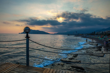 Obraz premium pier with lamp at sunset