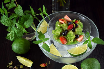 Green granita with matcha tea, lime and mint topped with fresh berries