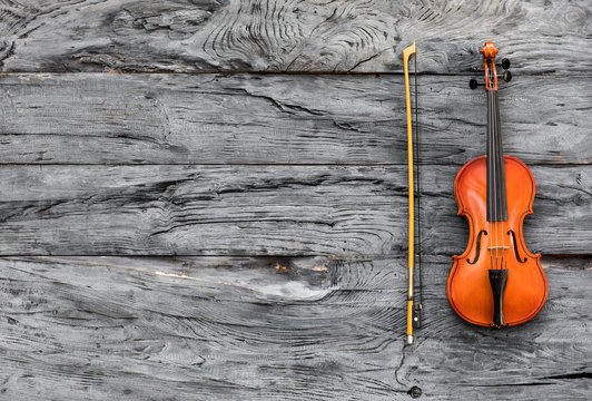 violin on an old wooden table