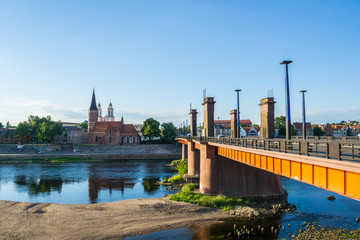 Naklejka premium Lithuania, Vytautas Church and bridge in Kaunas in dawning light