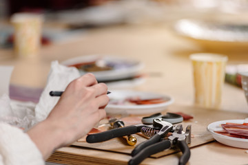 Closeup photo of mosaic master working on creating mosaic