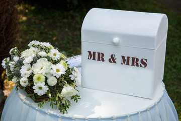 Floral decoration with the box for the bridal ceremony. Mr and Mrs, new family. Wedding day