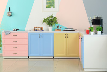 Fototapeta na wymiar Colorful modern kitchen interior
