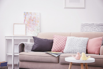 Modern living room interior with cozy sofa