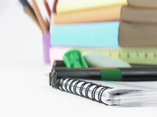 close up.white ball point pen on the notebook .photo with copy space