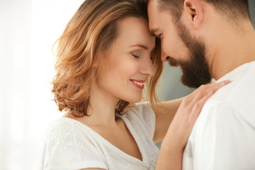 Lovely couple dancing together at home