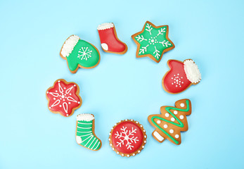 Fototapeta na wymiar Frame of tasty homemade Christmas cookies on color background, top view