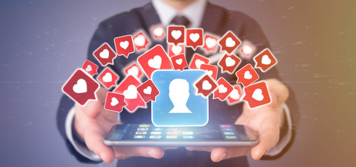 Businessman holding  Like notification on a contact on a social media 3d rendering © Production Perig