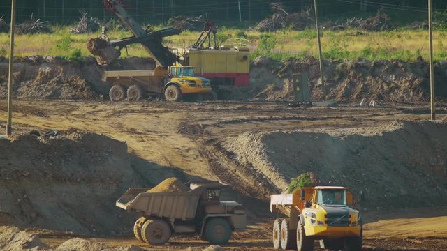 Traffic of mining dump trucks in the development of a sand pit
