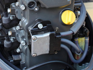 Fuel pump and oil filler neck of outboard boat motor close-up - engine maintenance, oil change