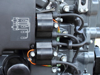 Wiring diagram, ignition coils and high voltage wires with tips on four-cylinder outboard motor