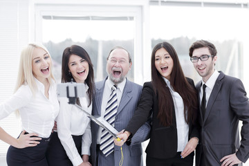 head and friendly business team taking selfie.