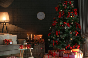 Stylish room interior with decorated Christmas tree