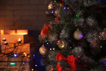 Obraz na płótnie Canvas Christmas tree with beautiful decorations indoors, closeup. Stylish interior element