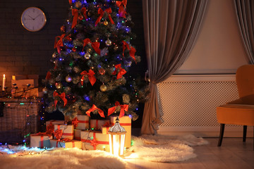 Stylish room interior with decorated Christmas tree