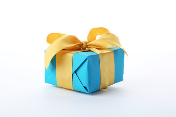 Beautiful gift box with ribbon on white background