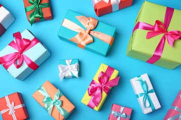 Flat lay composition with beautiful gift boxes on color background - Powered by Adobe