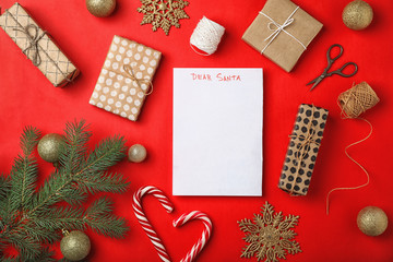 Flat lay composition with childish letter to Santa Claus and Christmas decoration on color background