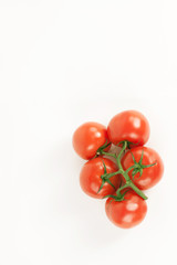 tomatoes on a branch .isolated white background