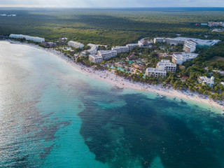 Akumal bay Caribbean beach in Riviera Maya. Aerial view of Sea side beach. Top view aerial video of beauty nature landscape with tropical beach in Akumal, Mexico. Caribbean Sea, coral reef, top view