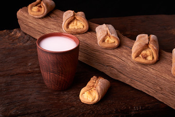 Homemade cakes with cottage cheese on brown wooden table. Studio Photo, selective focus